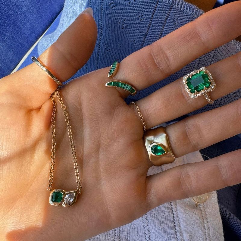 Queen Emerald Cut Emerald Ring with Full Pavé Diamond Halo by Logan Hollowell Jewelry