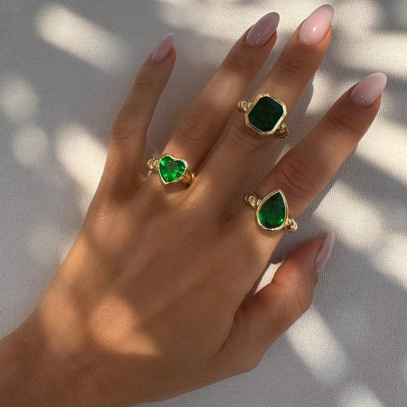 Tilted Water Drop Emerald Nautilus Ring by Logan Hollowell Jewelry