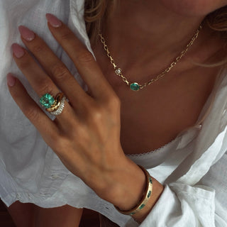 Floating Enigma Emerald Cushion Ring by Logan Hollowell Jewelry