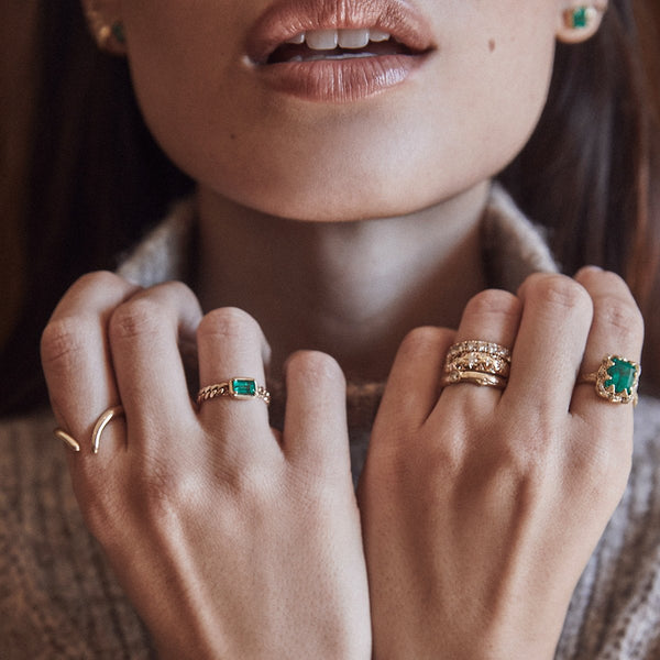 Queen Emerald Cut Emerald Ring with Sprinkled Diamonds by Logan Hollowell Jewelry