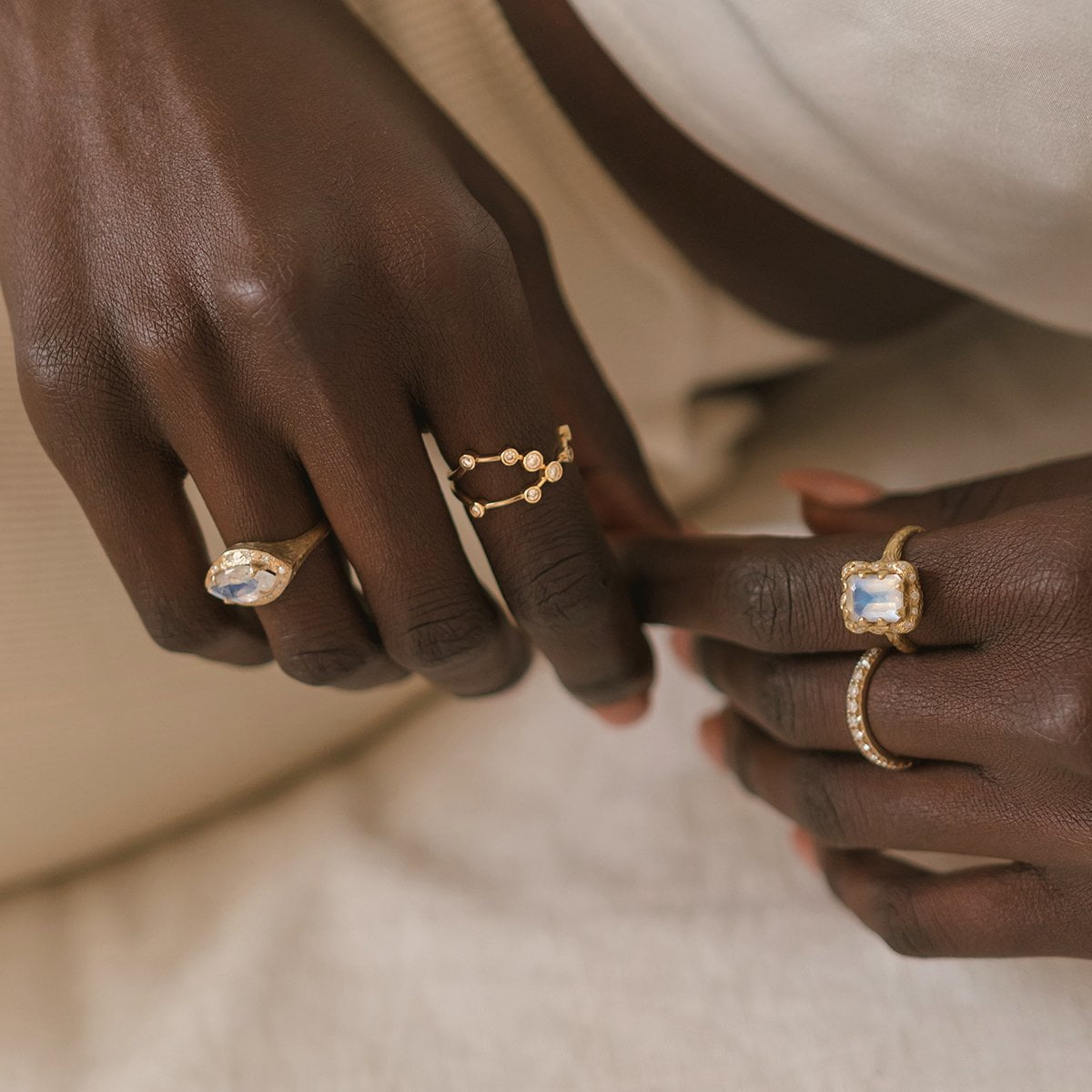 18k Queen Emerald Cut Moonstone Ring with Sprinkled Diamonds    by Logan Hollowell Jewelry